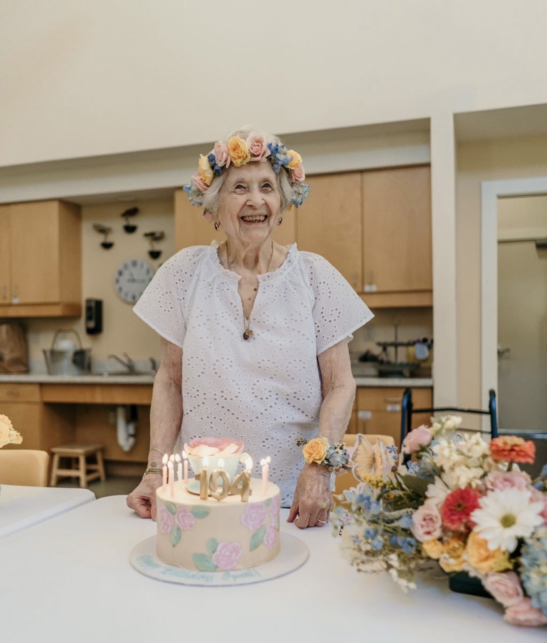 Auntie Opal wearing a flower crown at her 104th birthday garden party